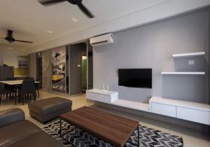 a living room with a flat screen tv on a wall at New Ipoh The Majestic Condo Homestay in Ipoh