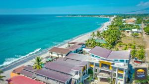 an aerial view of a beach with houses and the ocean at Miami Heat Beach Resort powered by Cocotel in Morong