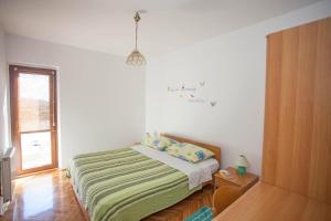 Posteľ alebo postele v izbe v ubytovaní Apartments and Room Agata