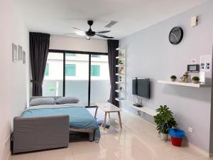 a bedroom with a bed and a tv in it at Suasana JB at JB Center Luxury Modern & Rustic 1BR Apt for Bussiness,Vacation trips in Johor Bahru