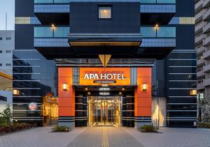 a hotel entrance with a hotel sign on the front at APA Hotel Hakata Higashihieekimae in Fukuoka