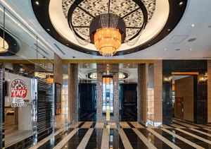 a lobby with a chandelier in a building at APA Hotel Hakata Higashihieekimae in Fukuoka