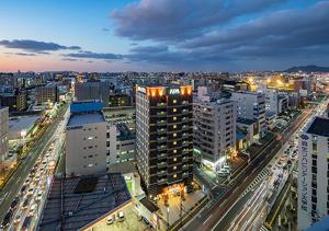 a view of a city at night with traffic at APA Hotel Hakata Higashihieekimae in Fukuoka