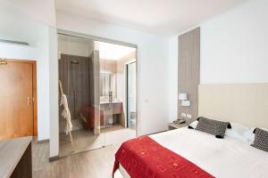 Postel nebo postele na pokoji v ubytování Hotel Venezia