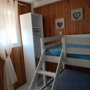 a bedroom with two bunk beds and a window at La Céret'nitude in Céret +12 photos