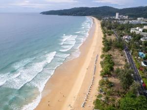 an aerial view of a beach with people on it at Baan Sailom Hotel Phuket - Sha Extra Plus in Karon Beach
