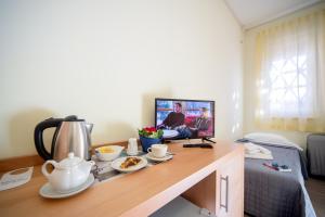 TV a/nebo společenská místnost v ubytování Hotel Foresteria