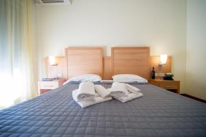 Postel nebo postele na pokoji v ubytování Hotel Foresteria