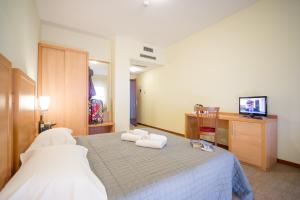 Postel nebo postele na pokoji v ubytování Hotel Foresteria