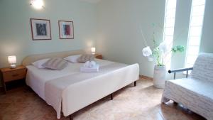 Postel nebo postele na pokoji v ubytování Villa Grace Felice