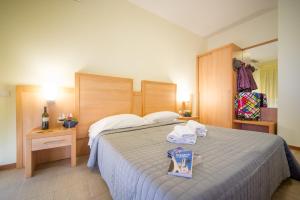 Postel nebo postele na pokoji v ubytování Hotel Foresteria