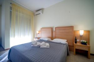 Postel nebo postele na pokoji v ubytování Hotel Foresteria