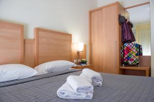 Postel nebo postele na pokoji v ubytování Hotel Foresteria