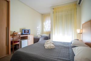 Postel nebo postele na pokoji v ubytování Hotel Foresteria
