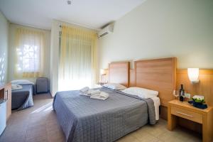 Postel nebo postele na pokoji v ubytování Hotel Foresteria