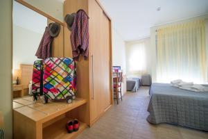 Postel nebo postele na pokoji v ubytování Hotel Foresteria