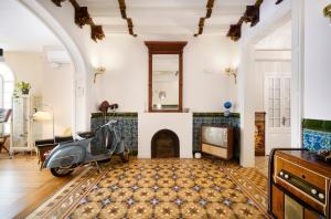 a scooter parked in a living room with a fireplace at numa l Roca Rooms & Apartments in Barcelona