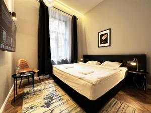 Posteľ alebo postele v izbe v ubytovaní Hotel Rumor