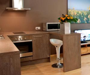 A kitchen or kitchenette at Jalaka Apartment with sauna