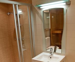 A bathroom at Jalaka Apartment with sauna