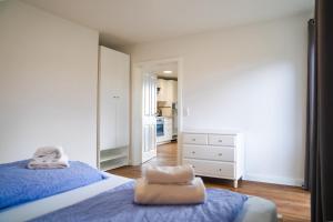 a bedroom with two beds with towels on them at Schleiblick App 17 in Rabenkirchen-Faulück