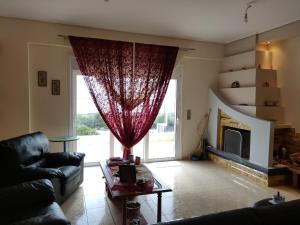 A seating area at Dimitris Vaso’s Villa with Sea and Mountain View!