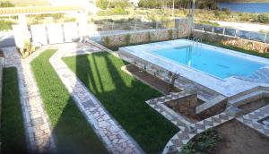 The swimming pool at or close to Dimitris Vaso’s Villa with Sea and Mountain View!