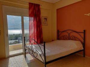 A bed or beds in a room at Dimitris Vaso’s Villa with Sea and Mountain View!