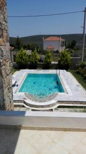The swimming pool at or close to Dimitris Vaso’s Villa with Sea and Mountain View!