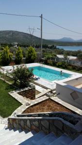 The swimming pool at or close to Dimitris Vaso’s Villa with Sea and Mountain View!