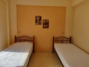 A bed or beds in a room at Dimitris Vaso’s Villa with Sea and Mountain View!