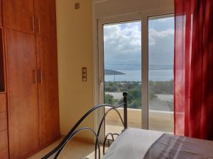 A bed or beds in a room at Dimitris Vaso’s Villa with Sea and Mountain View!