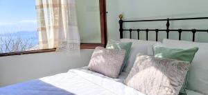 Posteľ alebo postele v izbe v ubytovaní Pelionature Home