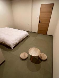 Letto o letti in una camera di 城崎温泉 小宿 紬 tsumugi