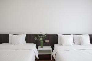 Postel nebo postele na pokoji v ubytování Hoang Loc Villa