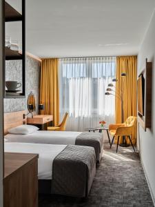 Posteľ alebo postele v izbe v ubytovaní 1891 Garni Hotel