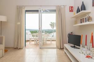 TV a/nebo společenská místnost v ubytování Ca Minorica -Apartamento-