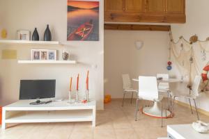 TV a/nebo společenská místnost v ubytování Ca Minorica -Apartamento-