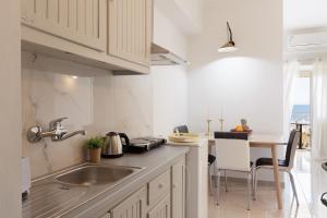 A kitchen or kitchenette at Salt & Sun Apartments by Konnect, at Kaminaki Beach