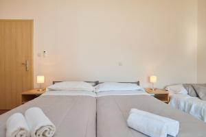 Posteľ alebo postele v izbe v ubytovaní Apartment Marijana