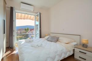 Posteľ alebo postele v izbe v ubytovaní Apartment Marijana