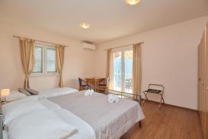 Posteľ alebo postele v izbe v ubytovaní Apartment Marijana