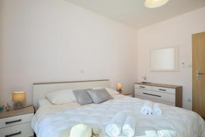 Posteľ alebo postele v izbe v ubytovaní Apartment Marijana
