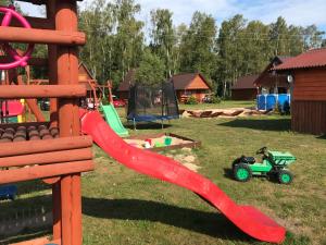 Children's play area at Domki KANZAS z klimatyzacją i ogrzewaniem