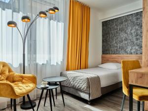 Posteľ alebo postele v izbe v ubytovaní 1891 Garni Hotel