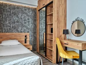 Posteľ alebo postele v izbe v ubytovaní 1891 Garni Hotel