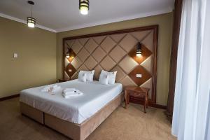 Postel nebo postele na pokoji v ubytování HOTEL ADRIANO