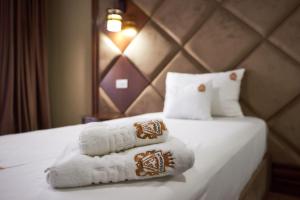 Postel nebo postele na pokoji v ubytování HOTEL ADRIANO