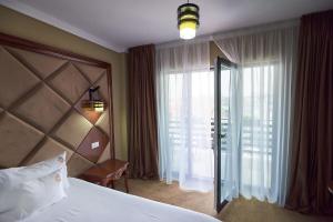 Postel nebo postele na pokoji v ubytování HOTEL ADRIANO