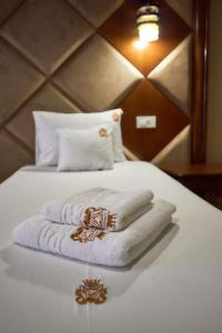 Postel nebo postele na pokoji v ubytování HOTEL ADRIANO